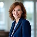 Portrait souriant d'Anne-Sophie Dubois, PDG de Voile Étoile, au bureau.